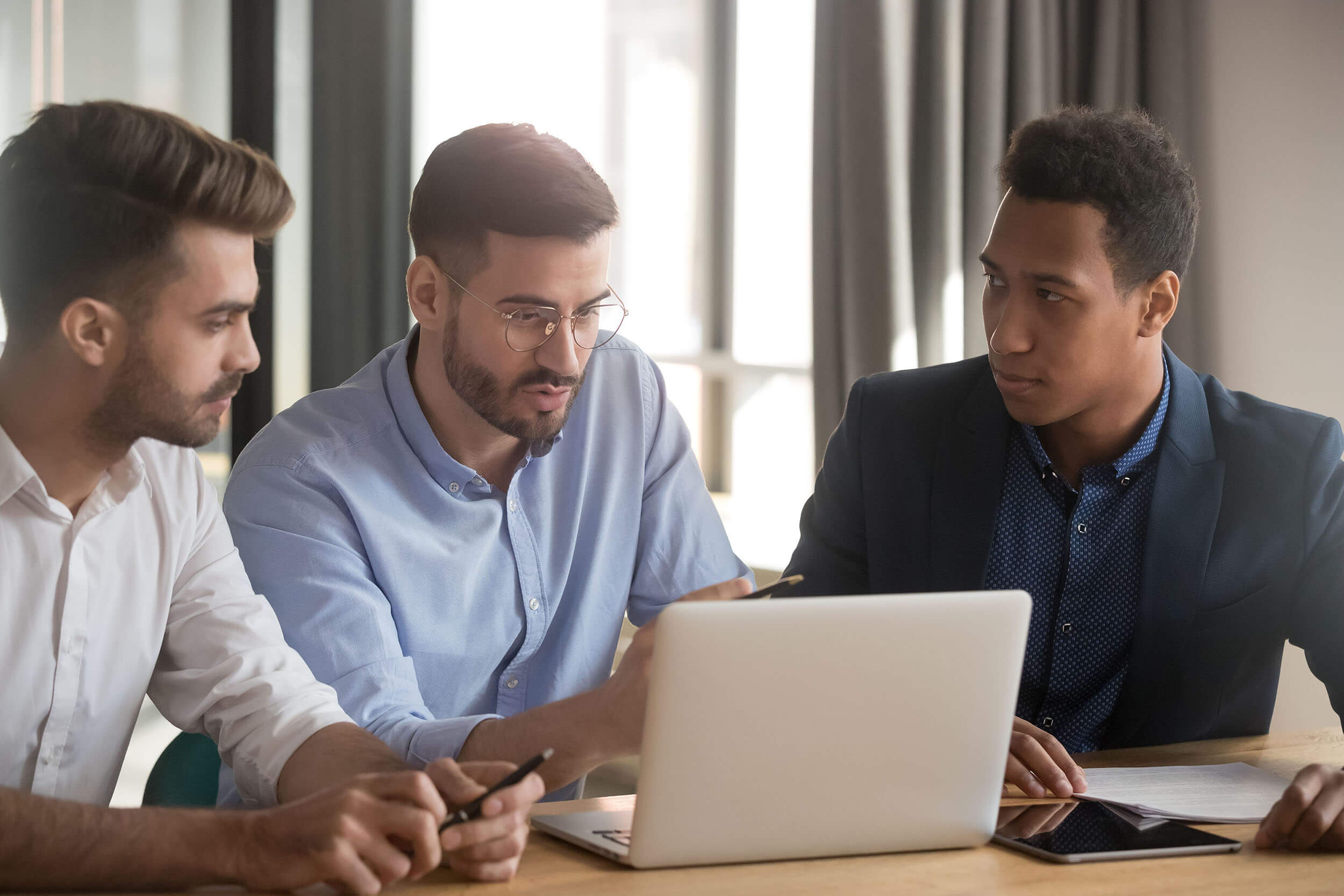 Business leaders discussing cybersecurity, compliance, and IT strategy
